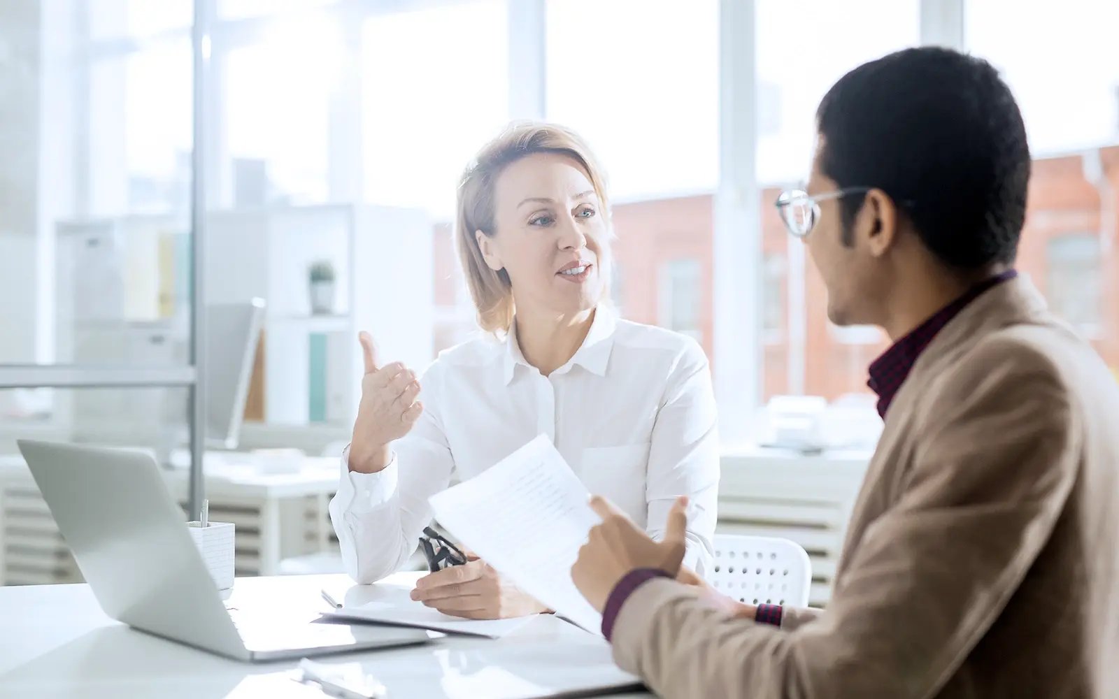2 employees in office environment